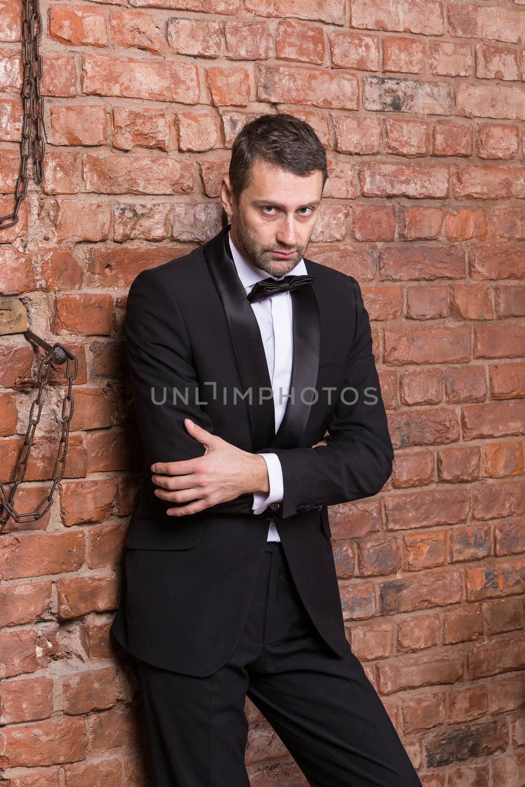 Elegant macho man in a bow tie by Discovod