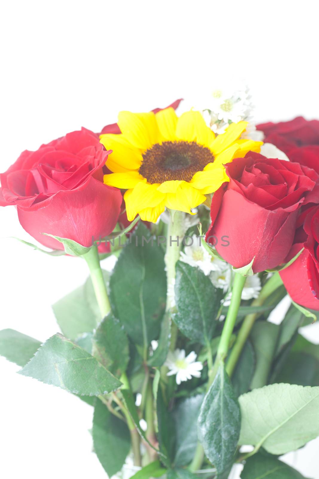 bouquet of red roses and sunflower in a vase 