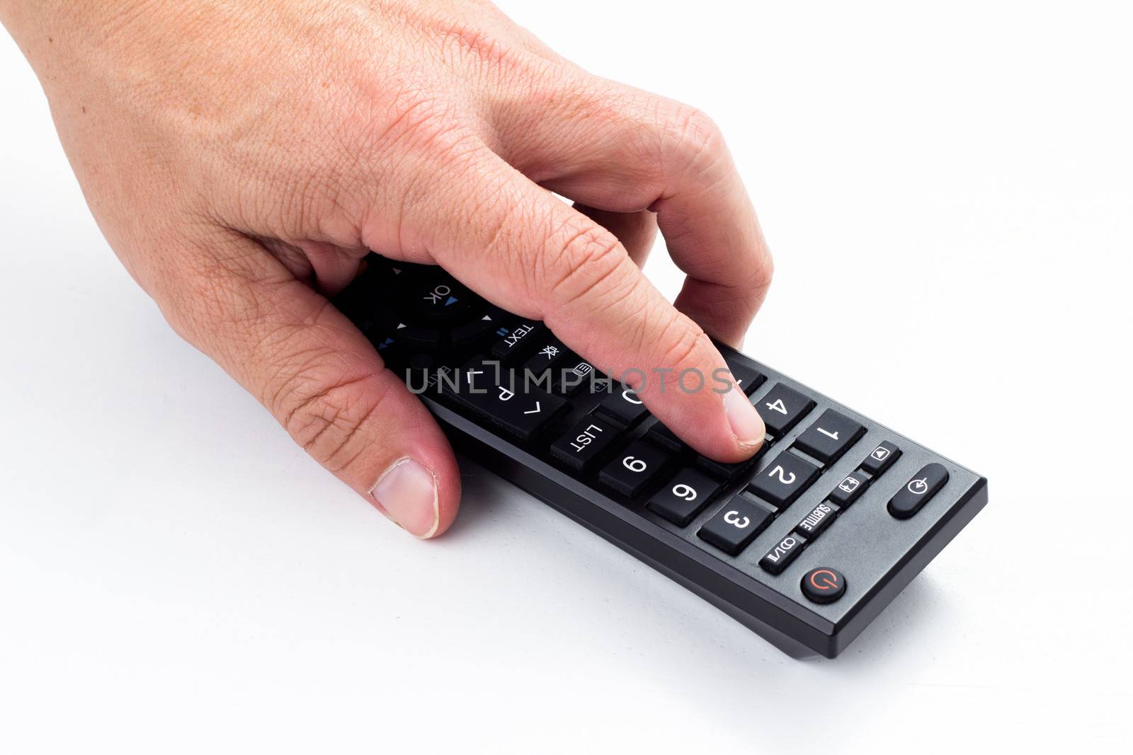 man hand push remote control on white