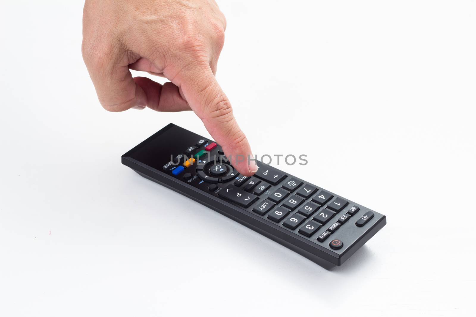 man hand push remote control on white