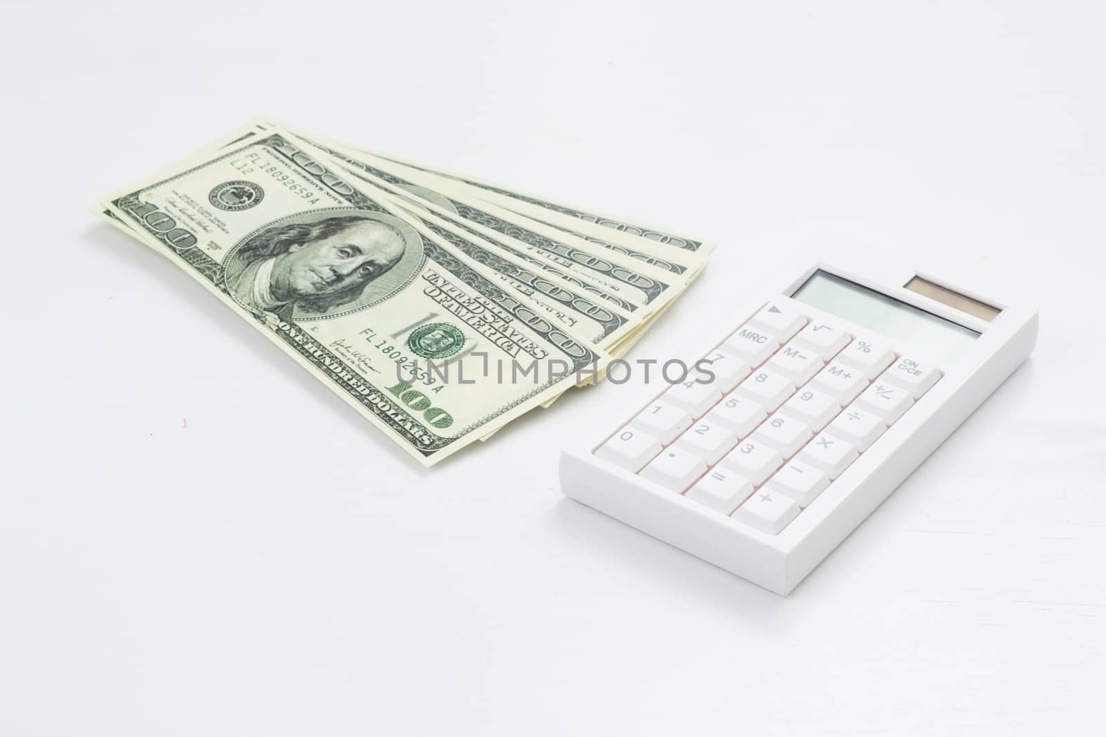 US bank note and calculator on white background