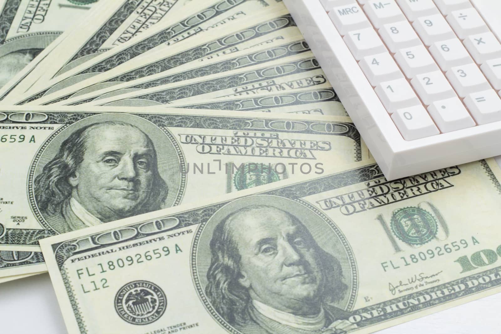 US bank note and calculator on white background