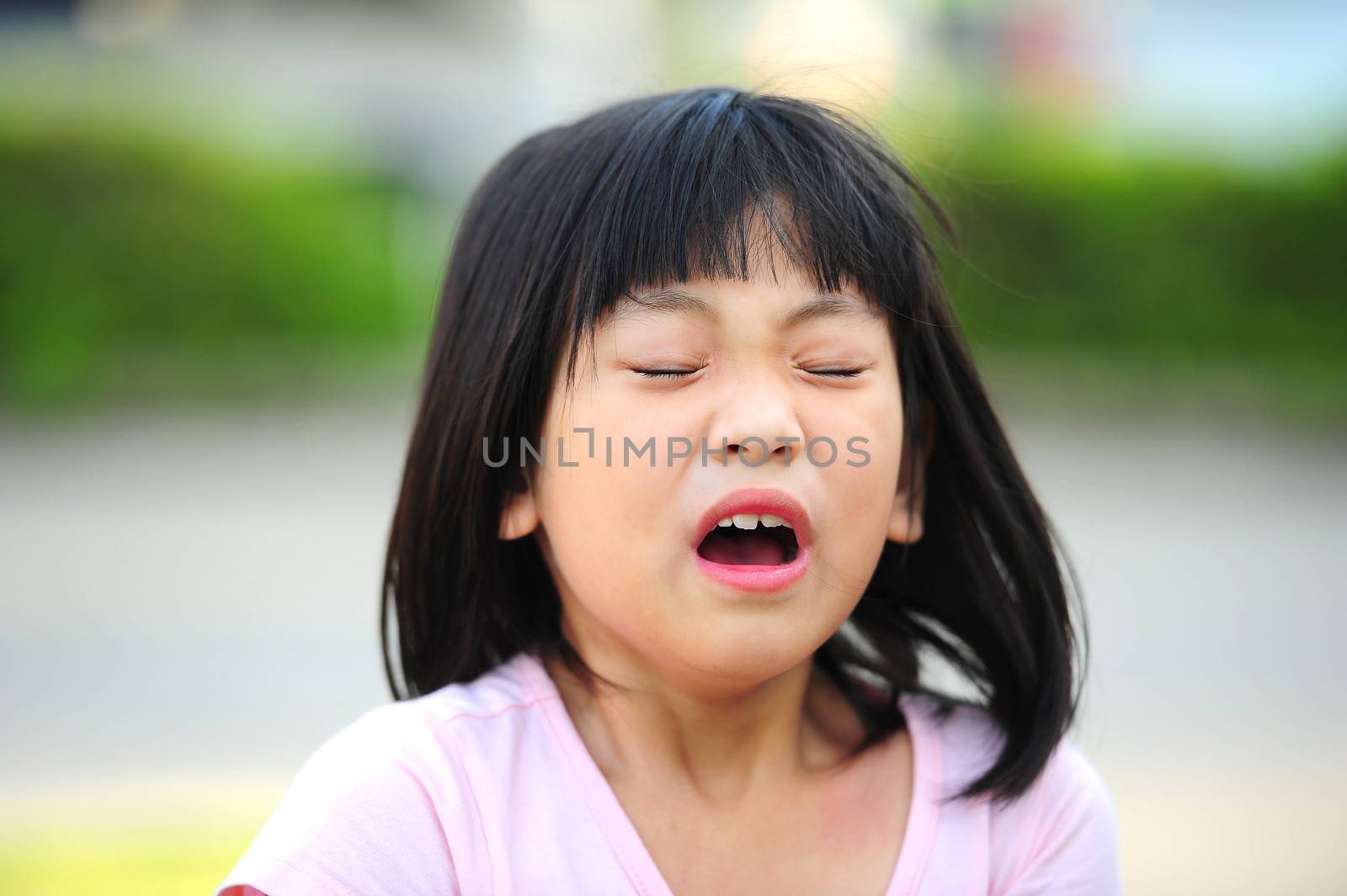 Girl sneezing