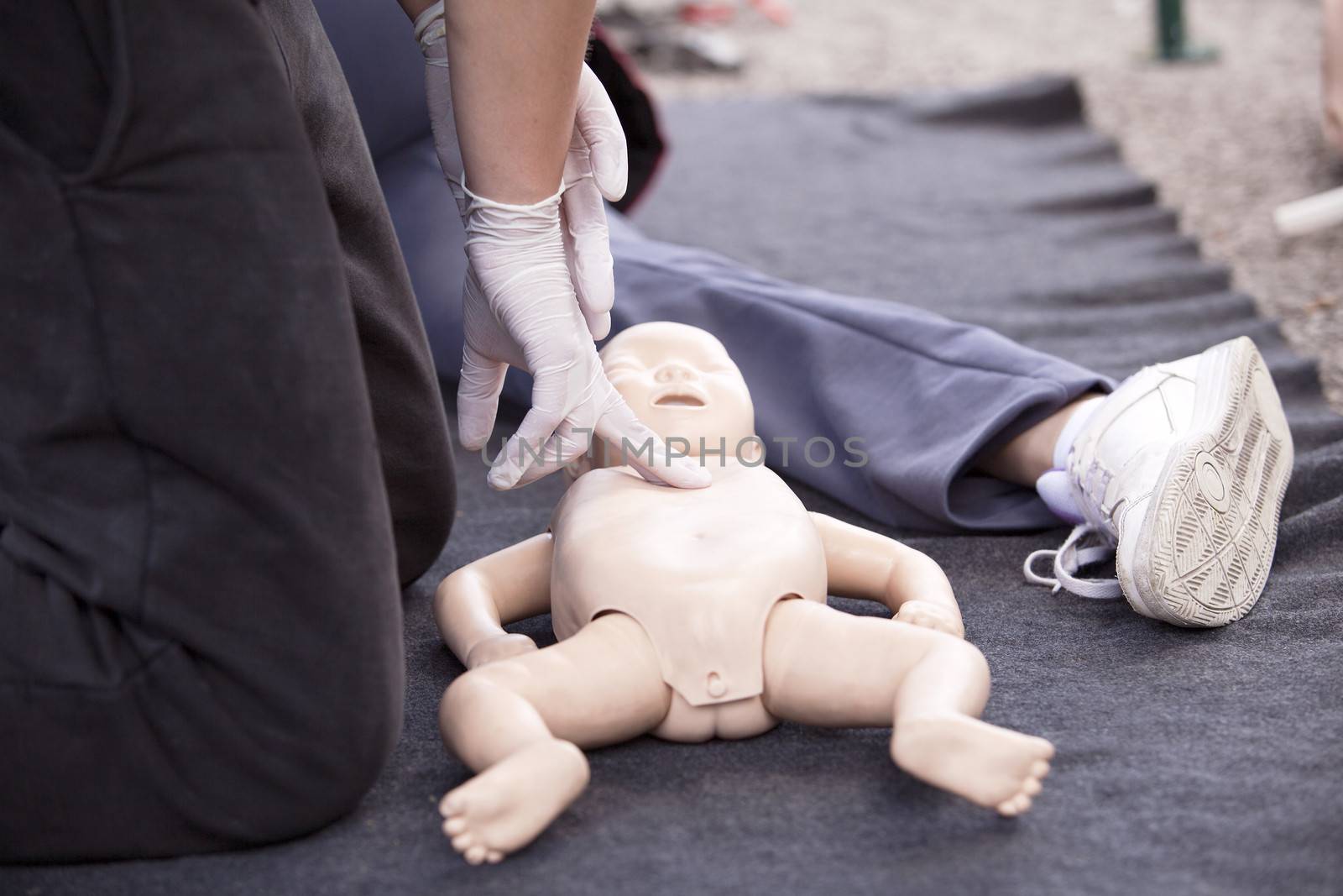 Infant dummy heart massage by wellphoto