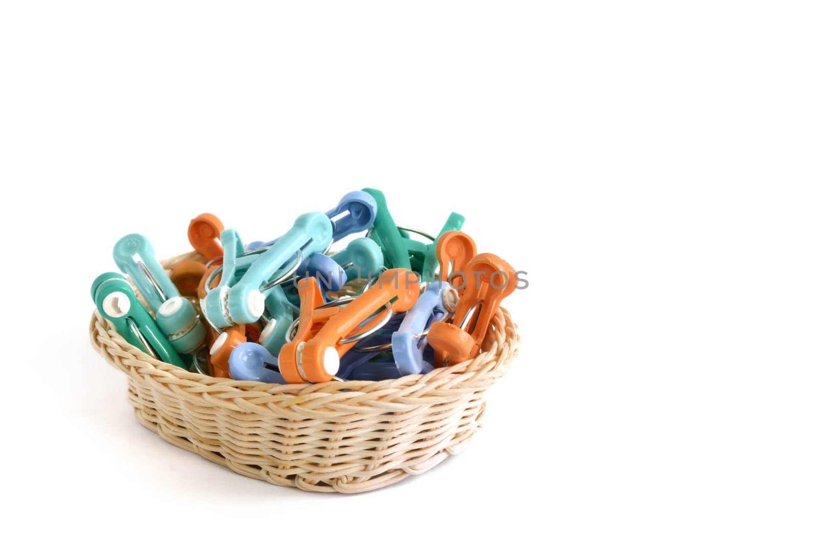 clothes pins with basket isolated on awhite background