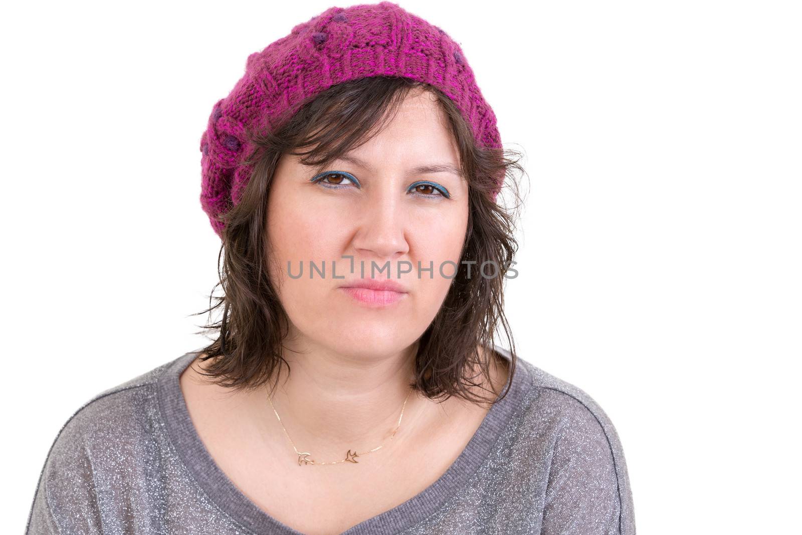 Woman making a judgemental assessment looking at the camera with a pensive analytical expression, isolated on white