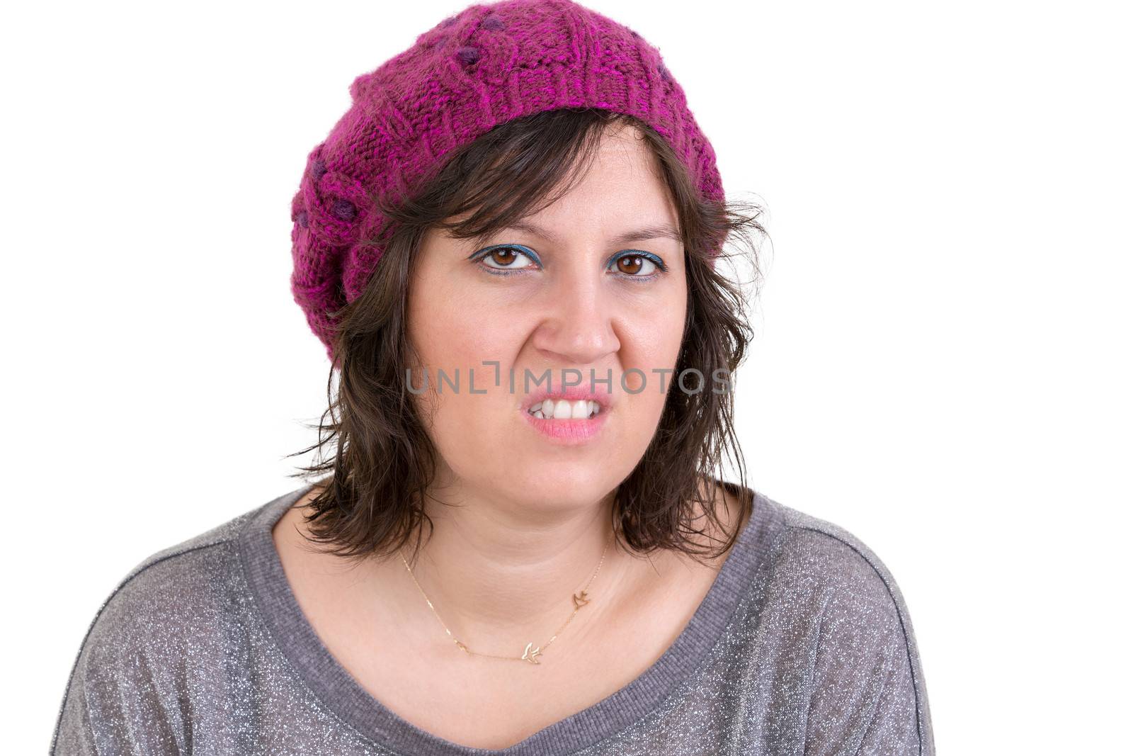 Nasty vindictive woman with a cold mean stare looking at the camera with a sneer, head and shoulders isolated on white