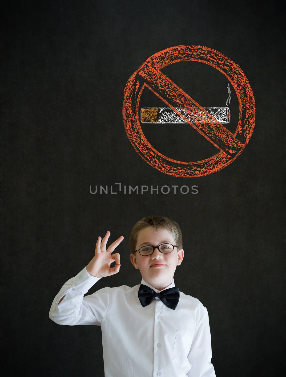 All ok or okay sign boy dressed up as business man with no smoking chalk sign on blackboard background
