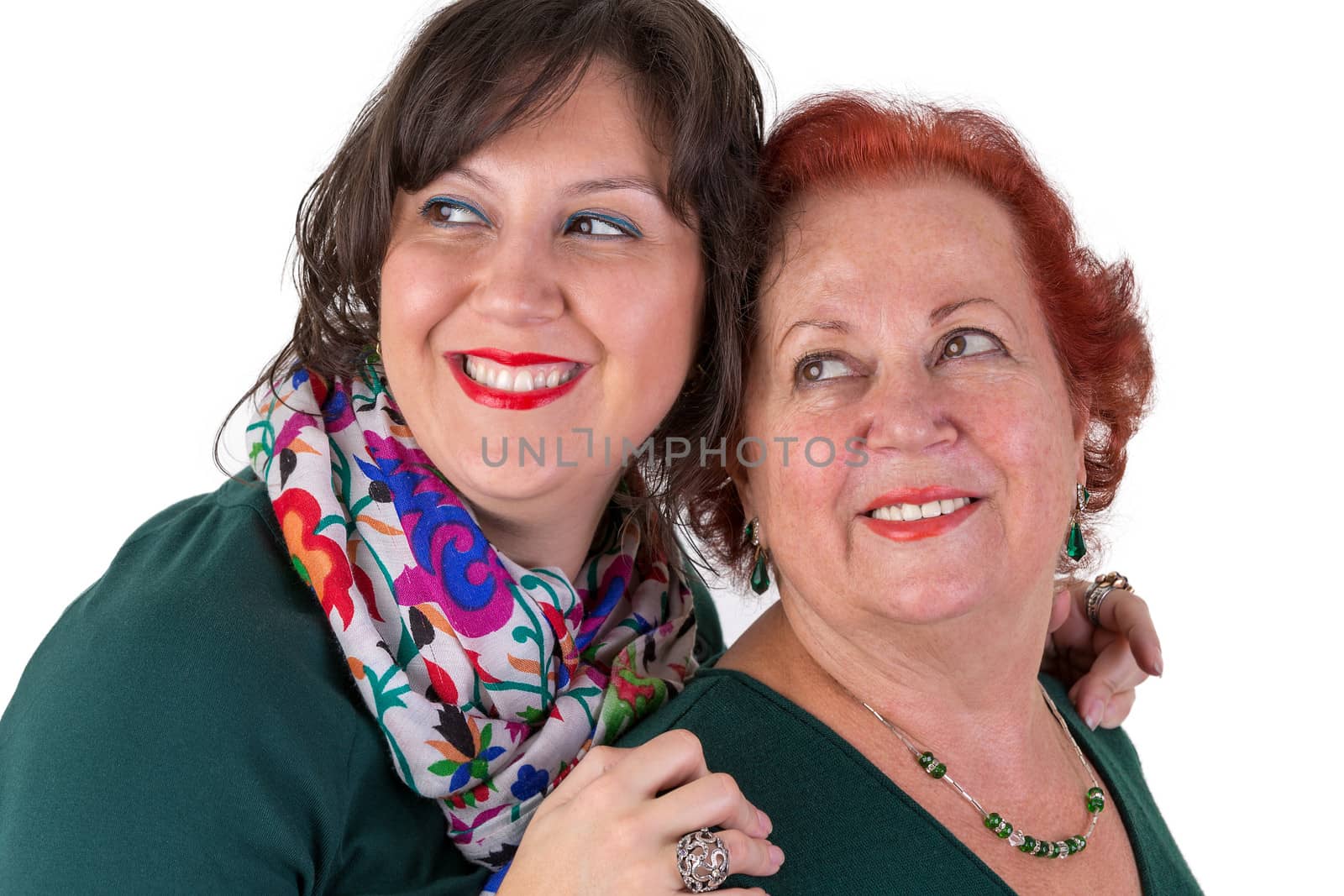 Senior Mother and Middle Age Daughter next to Each Other Looking by coskun