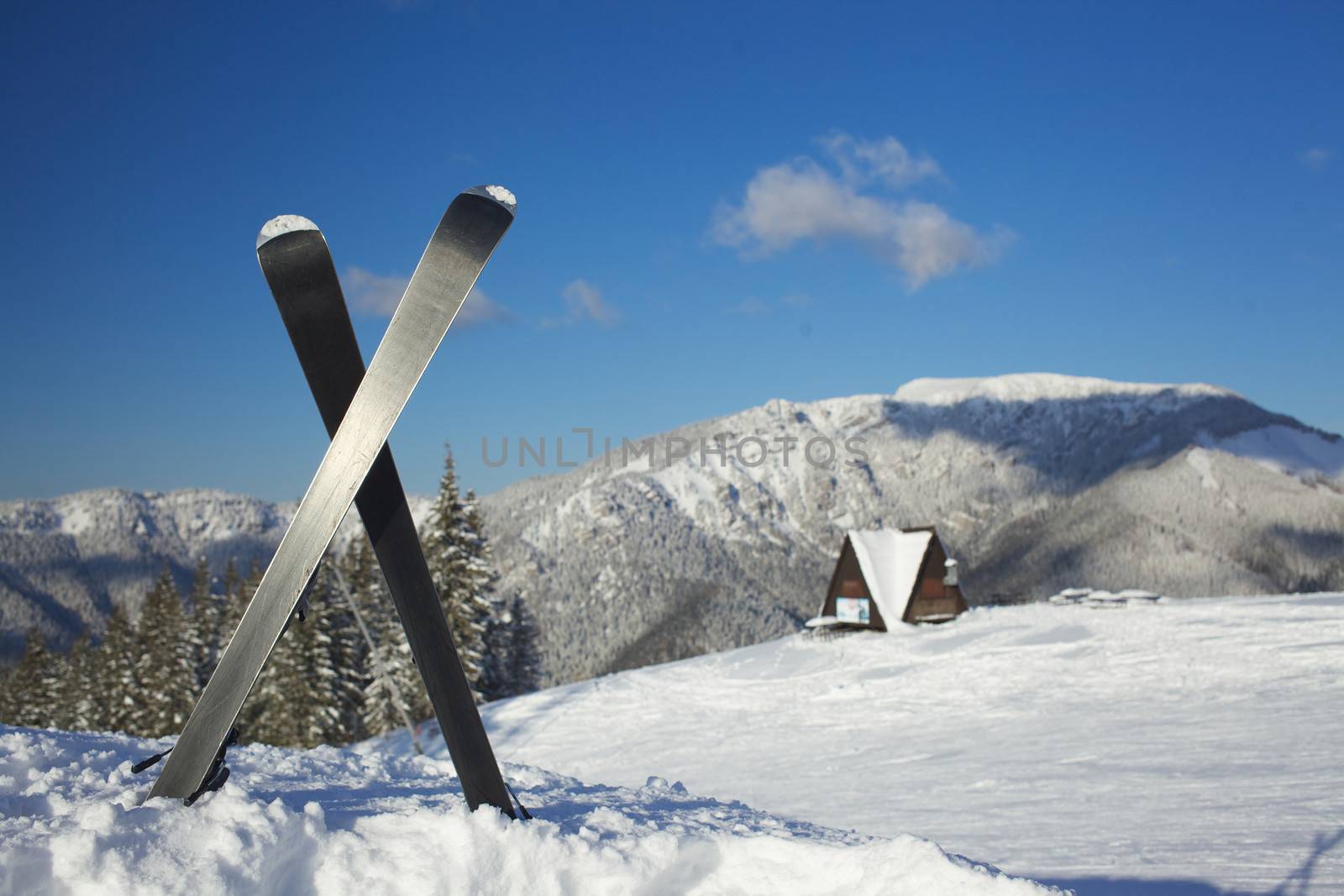 Skiing, winter season, mountains and ski equipments on ski run