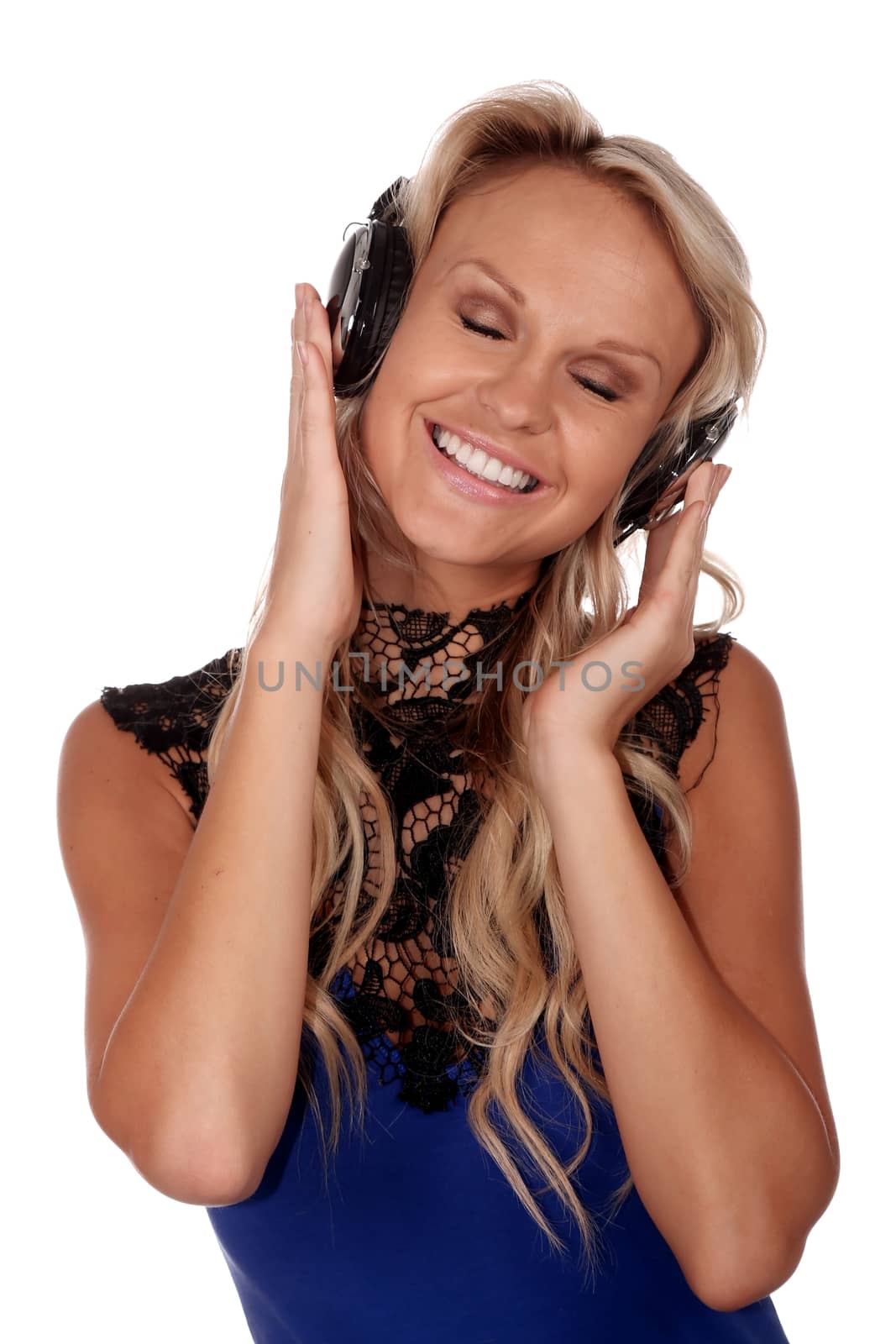 Pretty blond lady listening to music on her earphones