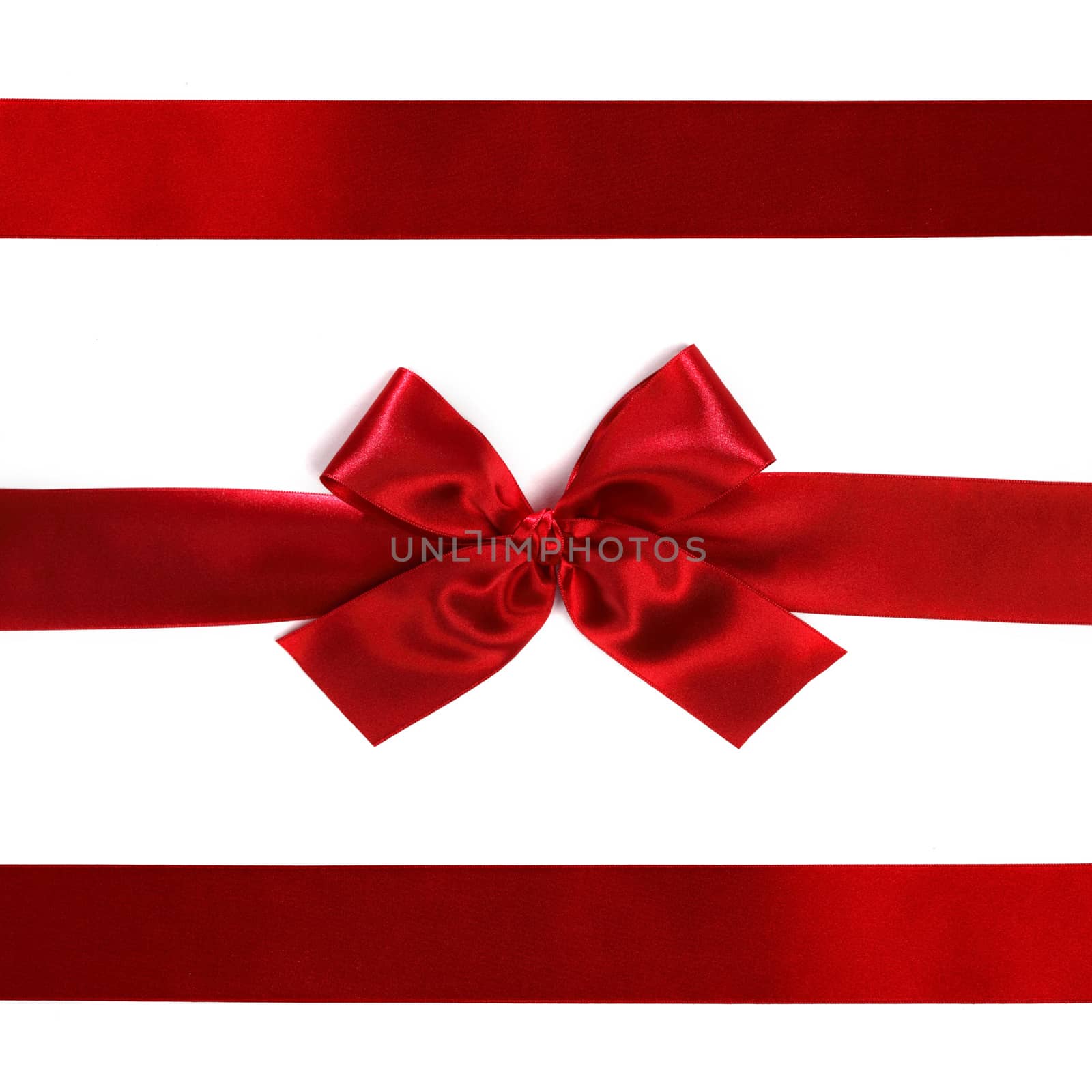 Red ribbon with bow on white by Yellowj