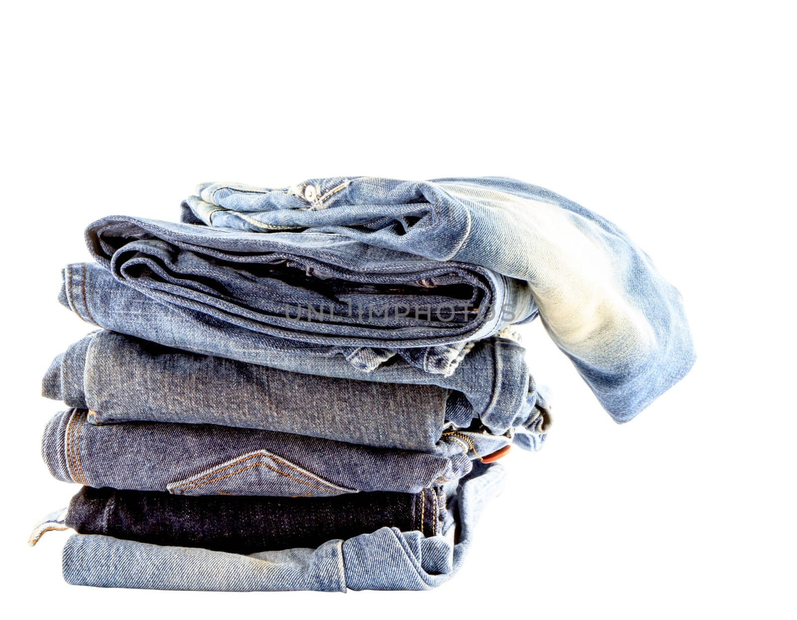 Stack of  jeans isolate on white background by bunwit