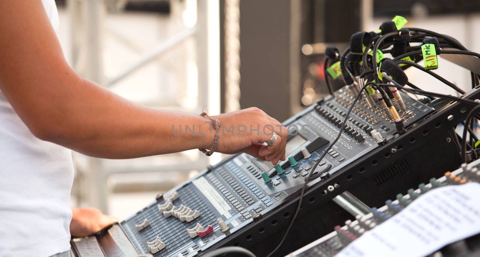 Hand over music mixer by wellphoto