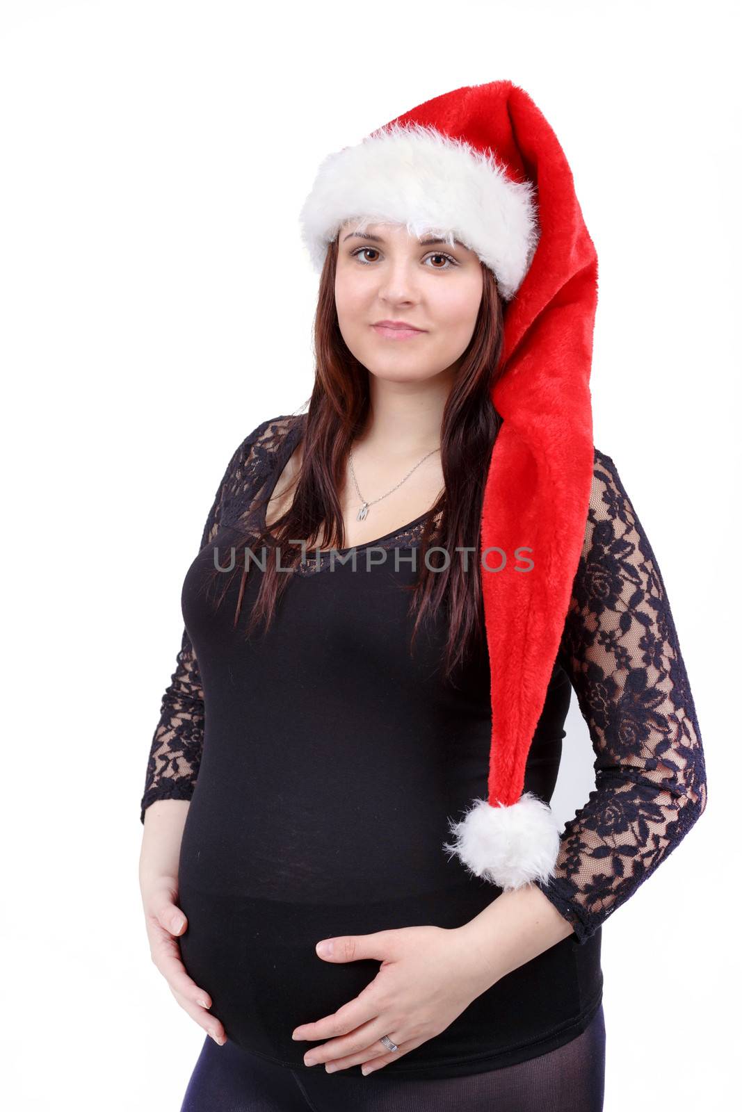 beautiful smiling pregnant santa woman tenderly holding her tummy isolated on white background