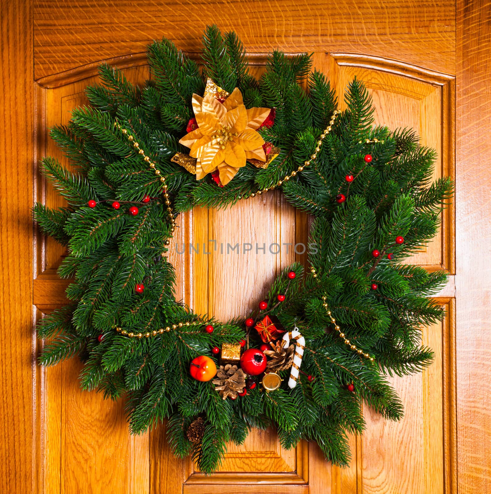 Christmas wreath with red sock on the door