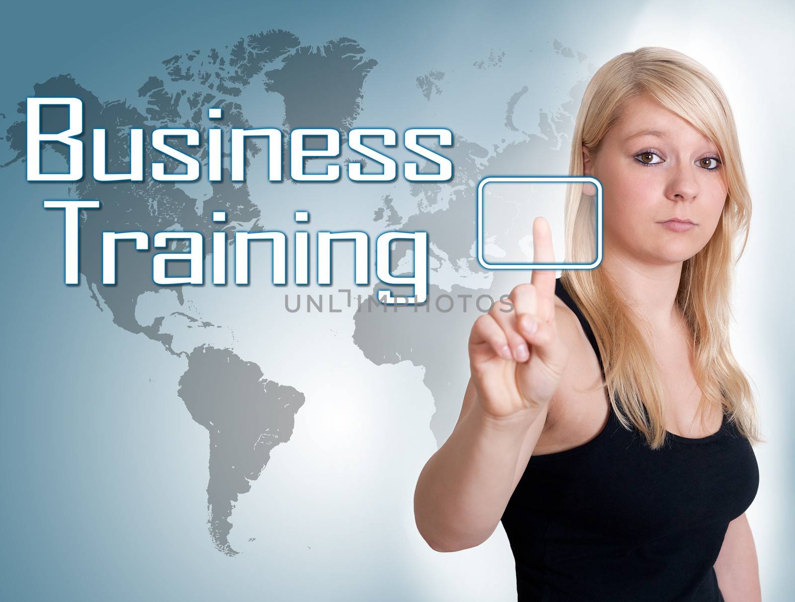 Young woman press digital Business Training button on interface in front of her