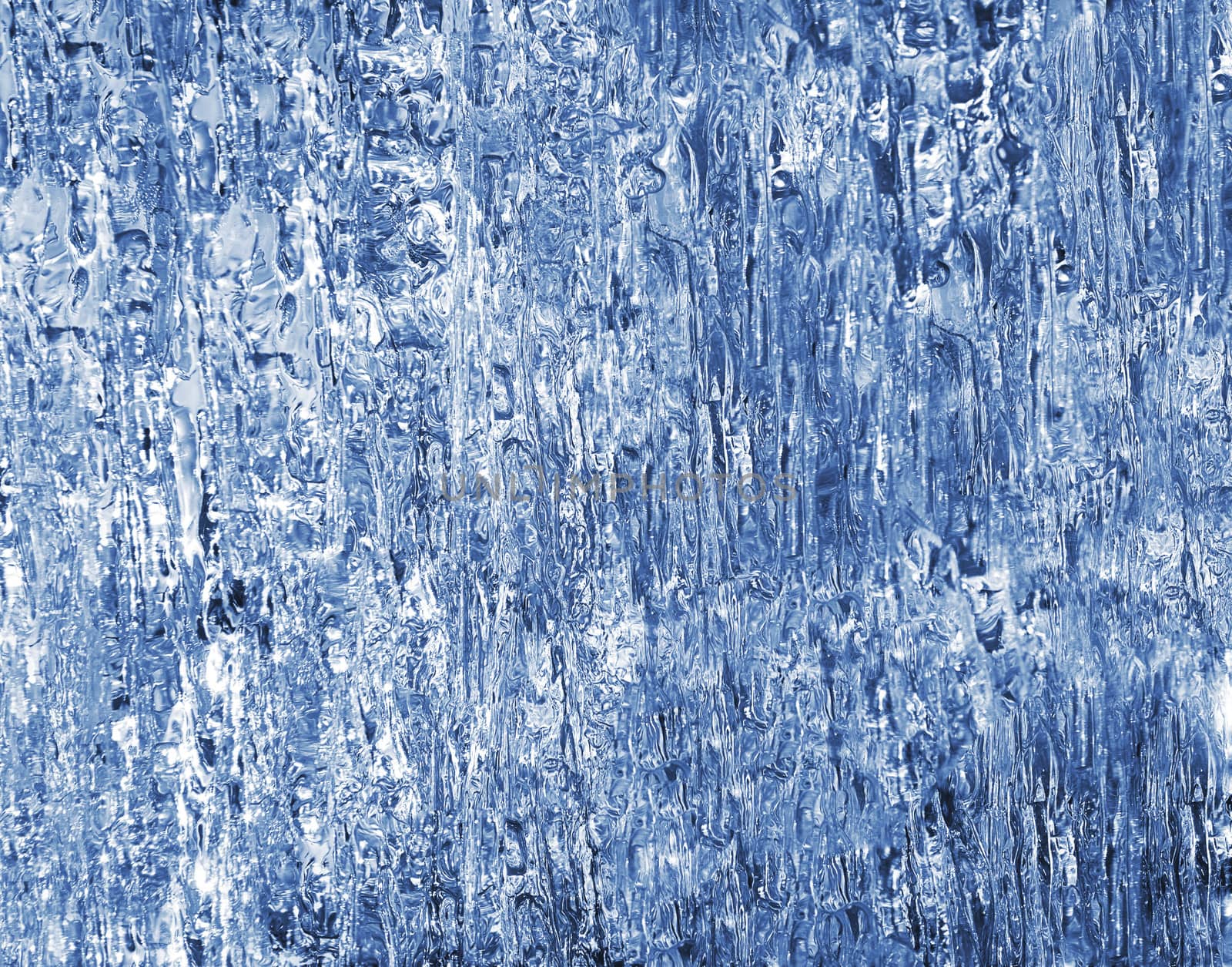 Block of blue smooth melting ice, close-up