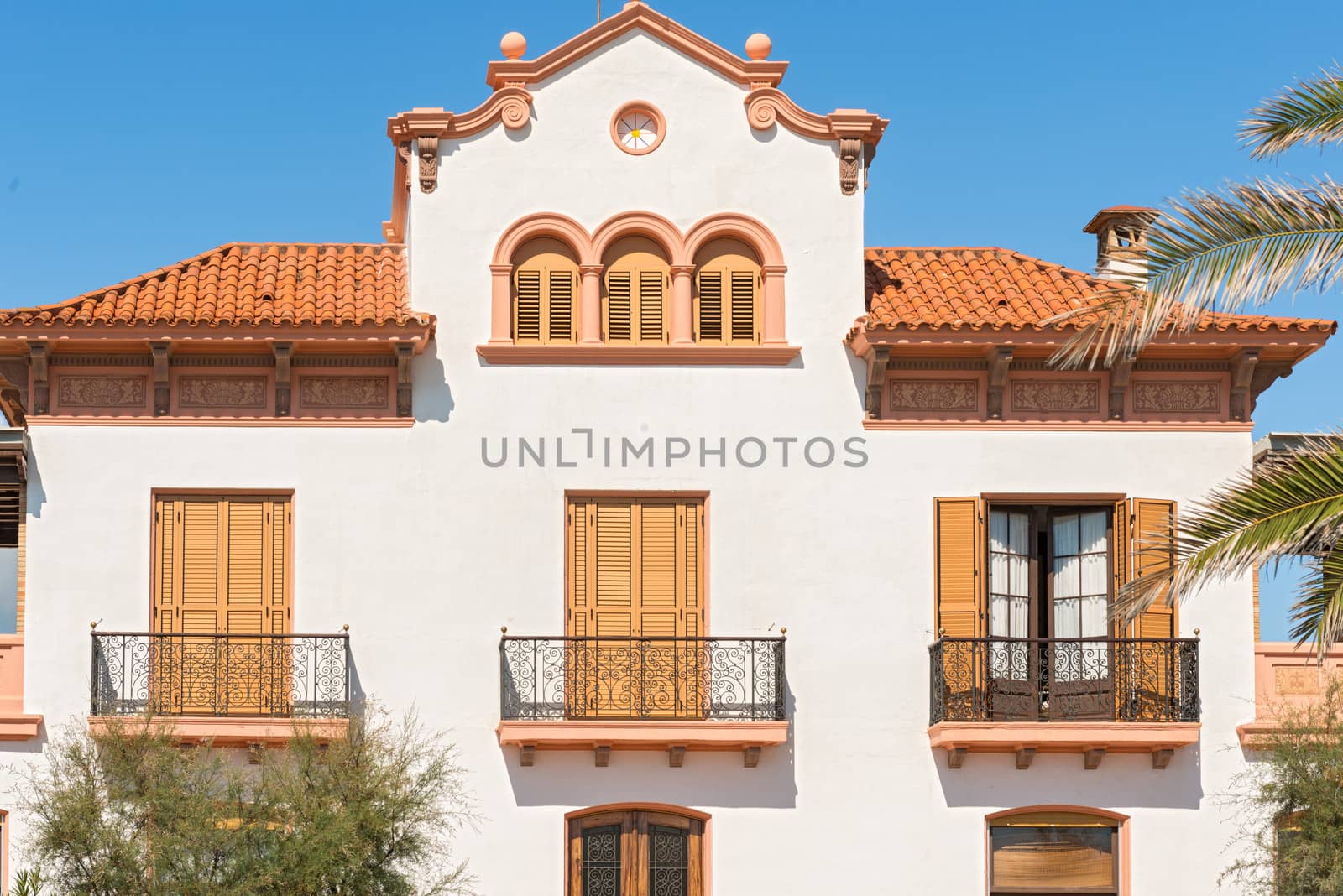 Sitges, Spain - September 21, 2013: Facade view at old  house in Sitges, Spain. The town is major tourist place during the summer.