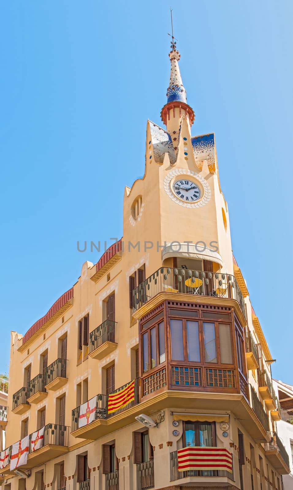 Sitges, Spain - September 21, 2013: View at old corner houses in Sitges, Spain. The town is major tourist place during the summer.