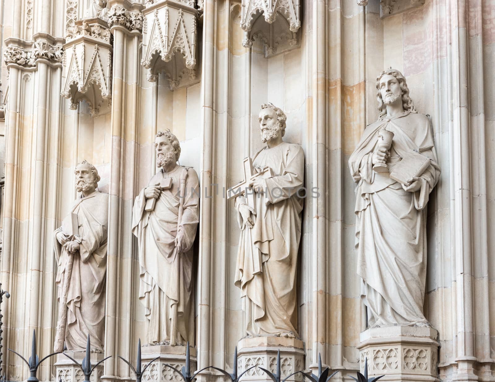 Statues at the entrance into cathedral in Barcelona, Spain. by Marcus