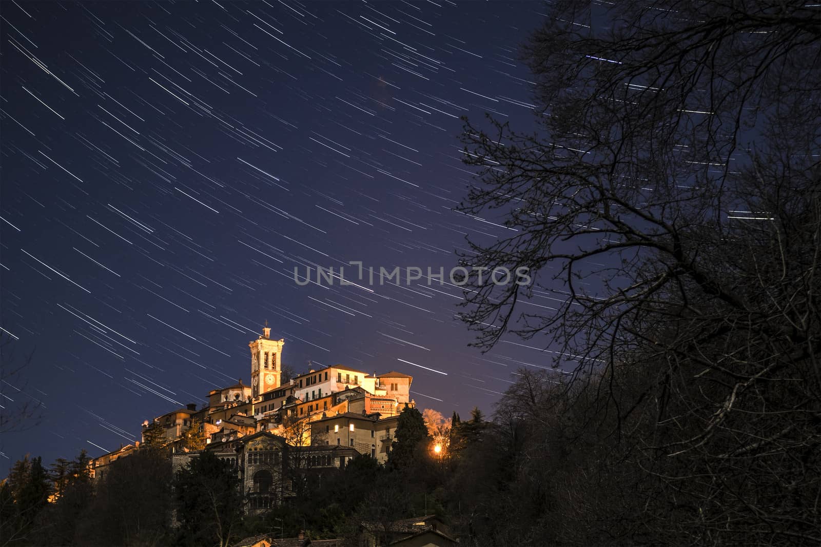 Sacred Mount of Varese and star trails in autumn evening, Lombardy - Italy