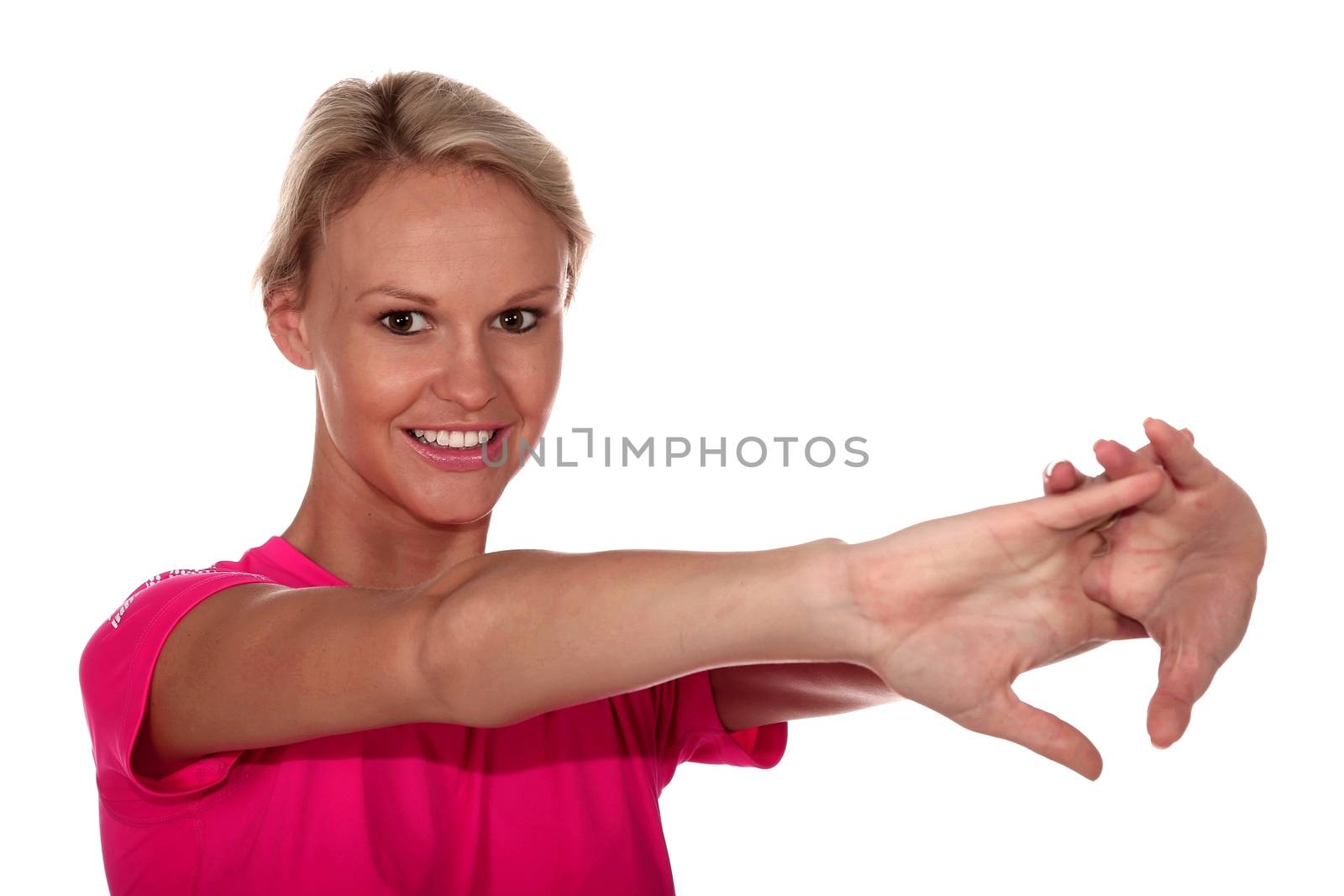 Healthy young blond lady stretching her arms isokated on white