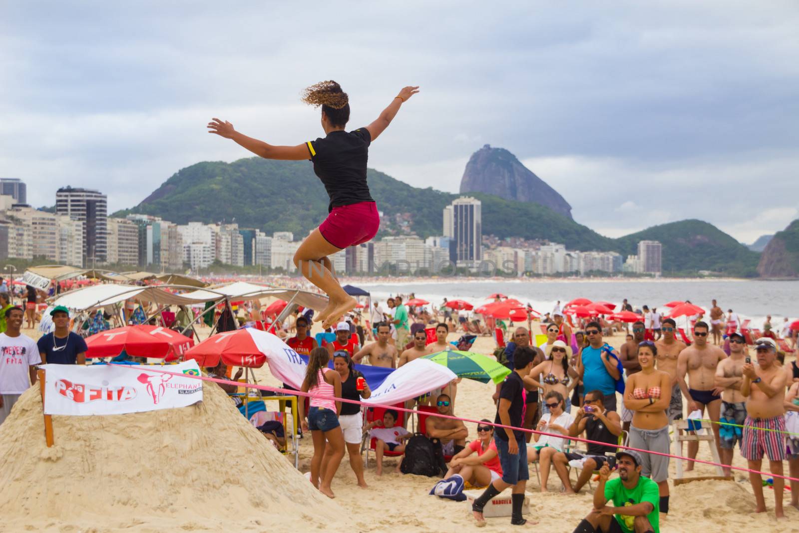 RIO DE JANEIRO - NOVEMBER 03 2012: Slackline contestant on the sands of Copacabana in Rio Elephant Cup tournament, held on November  03, 2012 on Copacabana, Rio de Janeiro, Brazil.