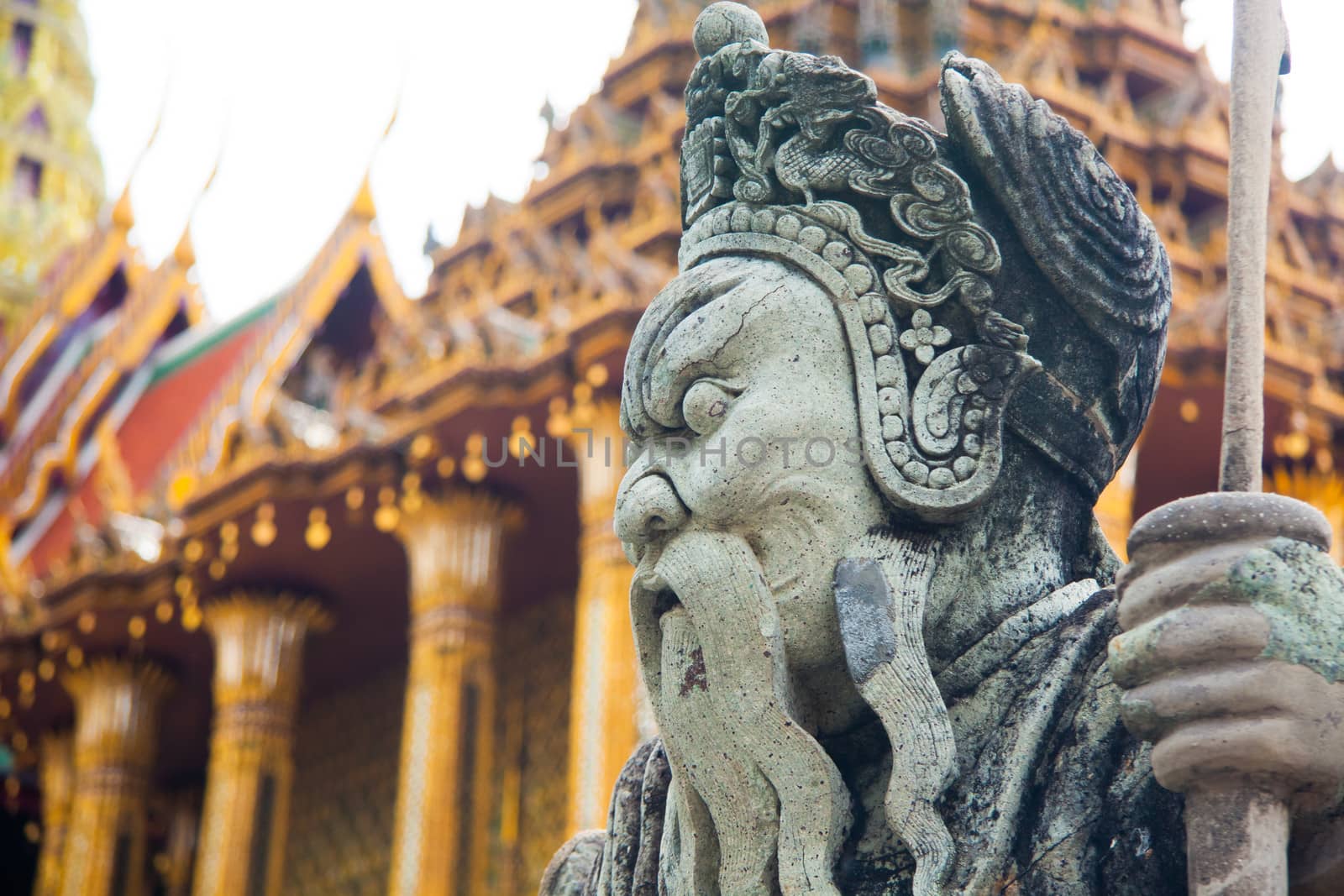 Statue in Wat Phra Kaew, Temple of the Emerald Buddha, full official name Wat Phra Si Rattana Satsadaram, is regarded as the most sacred Buddhist temple (wat) in Bangkok, Thailand.