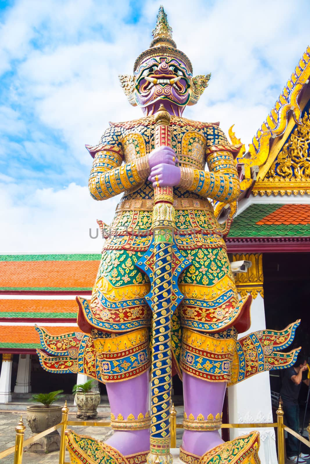 Giant statue in Wat Phra Kaew, Temple of the Emerald Buddha, full official name Wat Phra Si Rattana Satsadaram, is regarded as the most sacred Buddhist temple (wat) in Bangkok, Thailand.