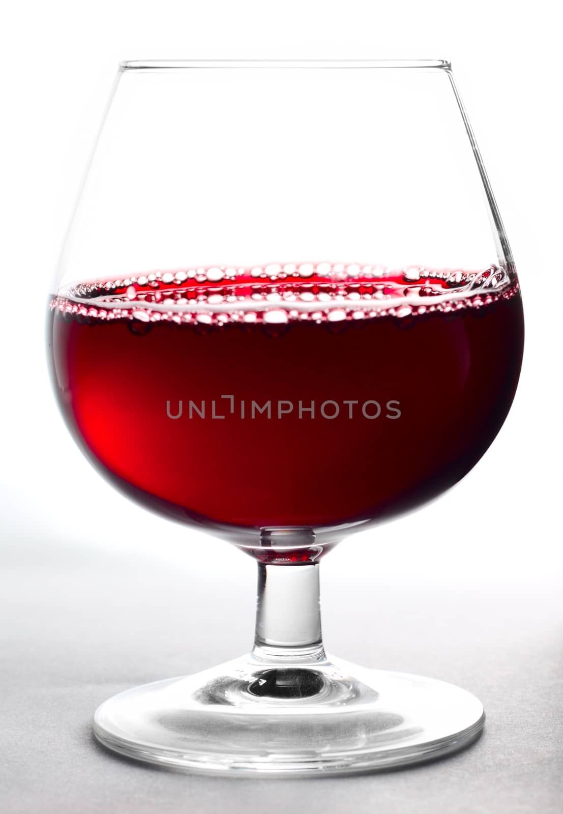 Glass of wine on a white background