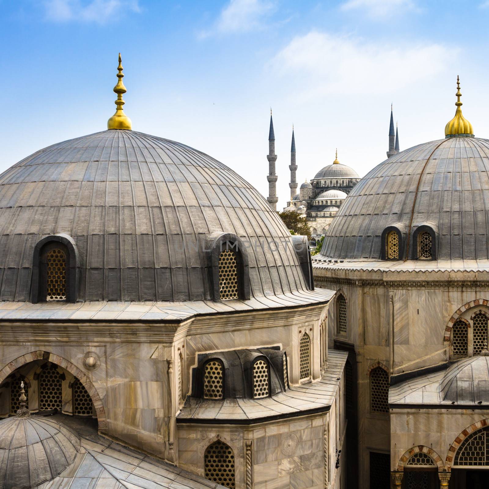 Blue Mosque or Sultan Ahmed Mosque viewed trough the window of Hagia Sophia, former Orthodox patriarchal basilica (church), later a mosque, and now a museum in Istanbul, Turkey.