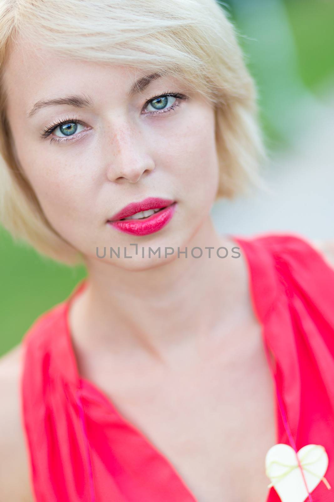 Portrait of a self-confident woman shot outside in the garden.