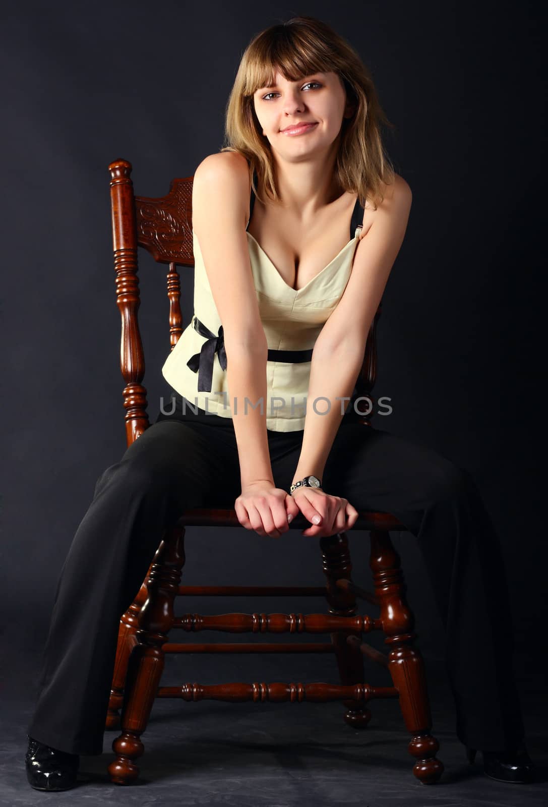 Girl sitting on a chair by dedmorozz