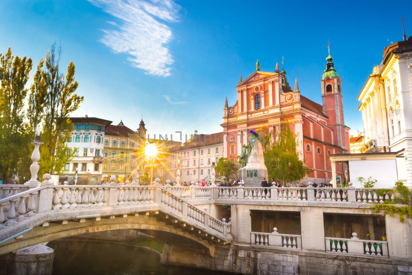 Romantic Ljubljana's city center:  river Ljubljanica, Triple Bridge (Tromostovje), Preseren square and Franciscan Church of the Annunciation; Ljubljana, Slovenia, Europe.