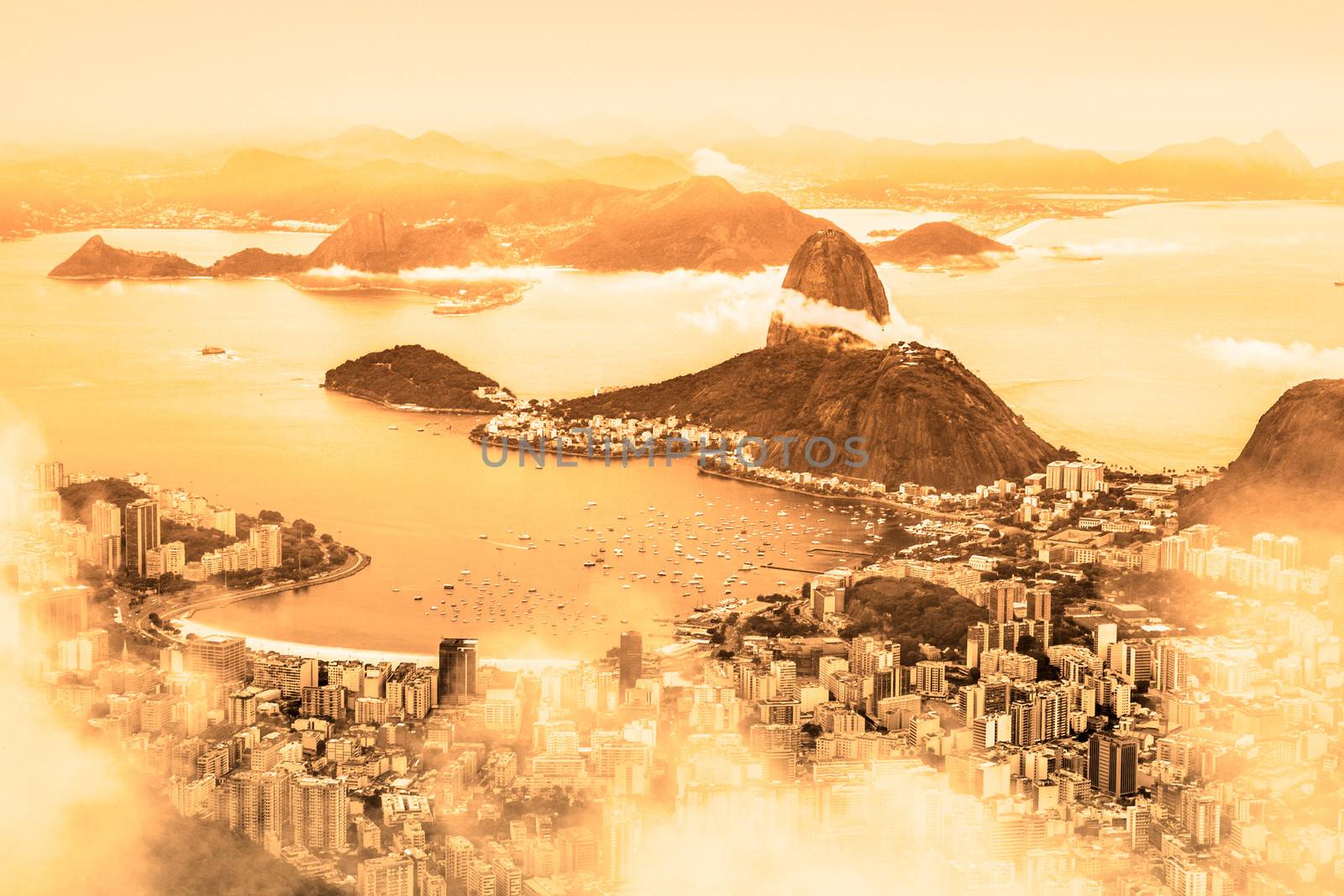 Rio de Janeiro, Brazil. Suggar Loaf and  Botafogo beach viewed from Corcovado at sunrise.