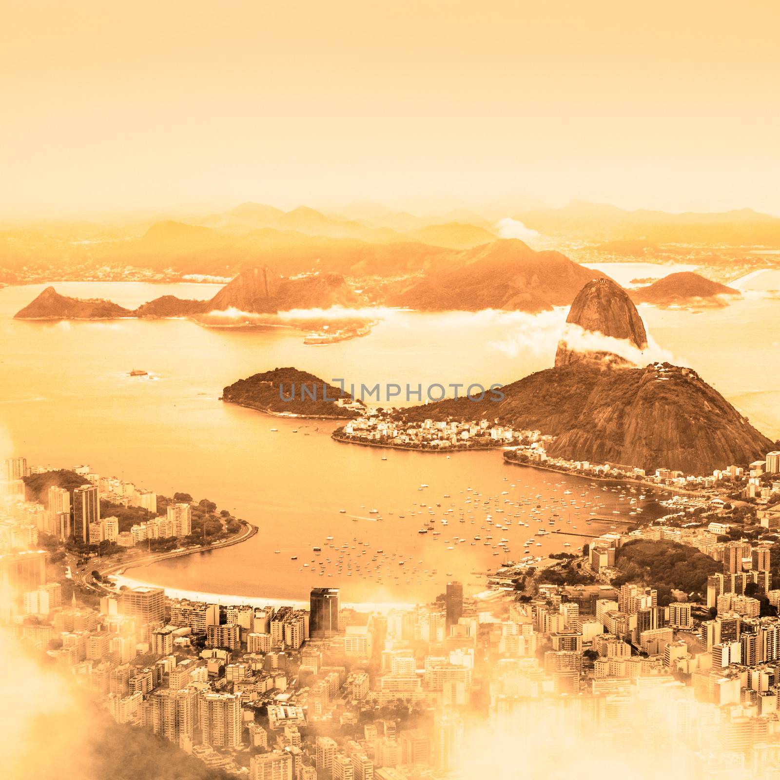 Rio de Janeiro, Brazil. Suggar Loaf and  Botafogo beach viewed from Corcovado at sunrise.