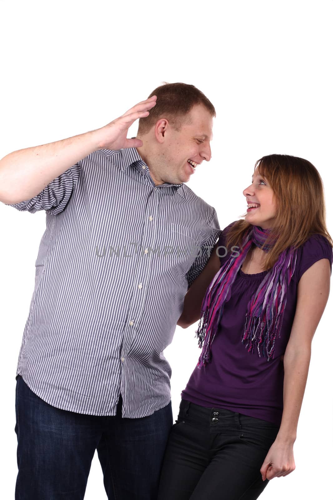 Young Lovely couple joking isolated on the white background