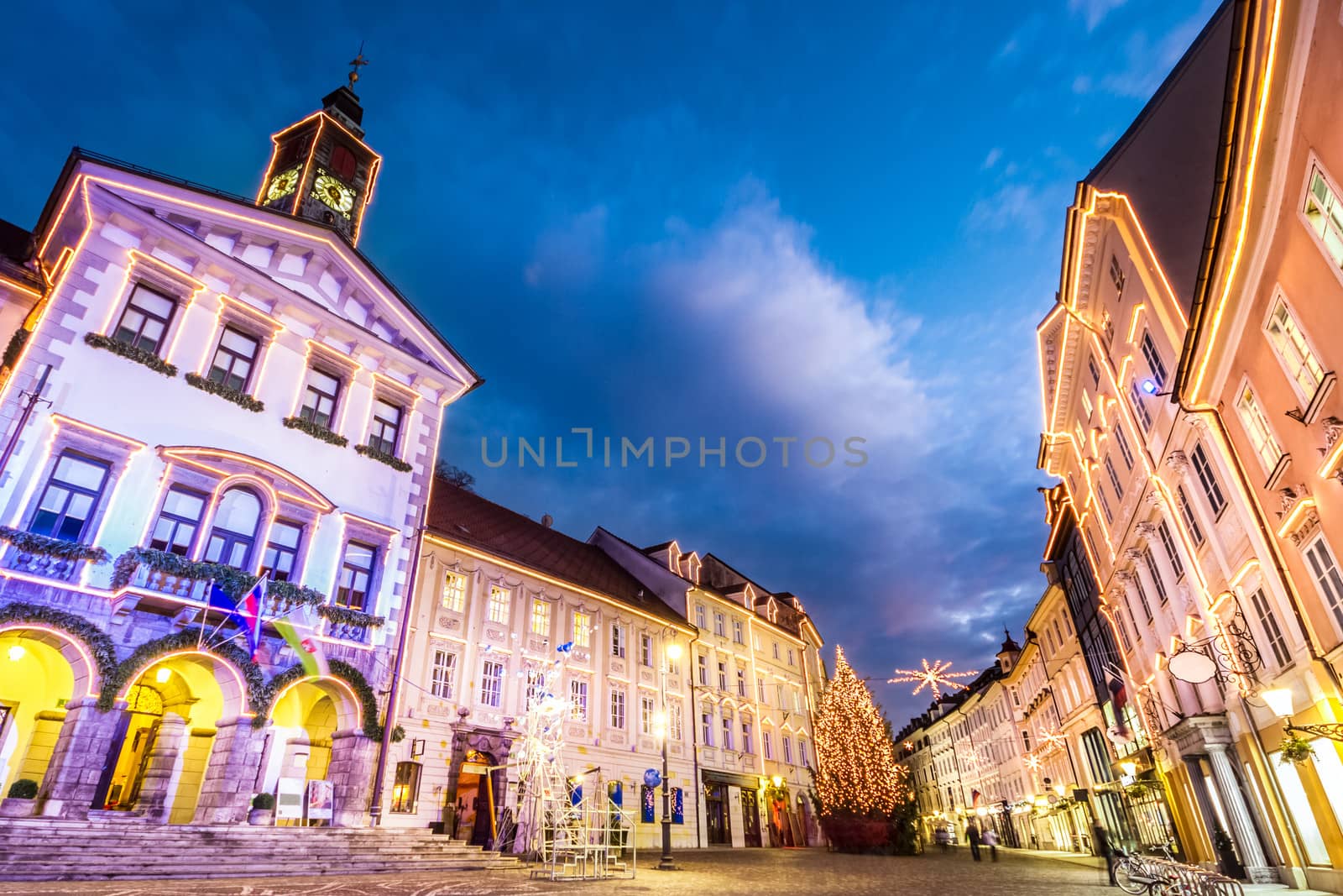 Romantic Ljubljana's city center, the capital of Slovenia, decorated for Christmas holidays. City Hall shot at dusk.