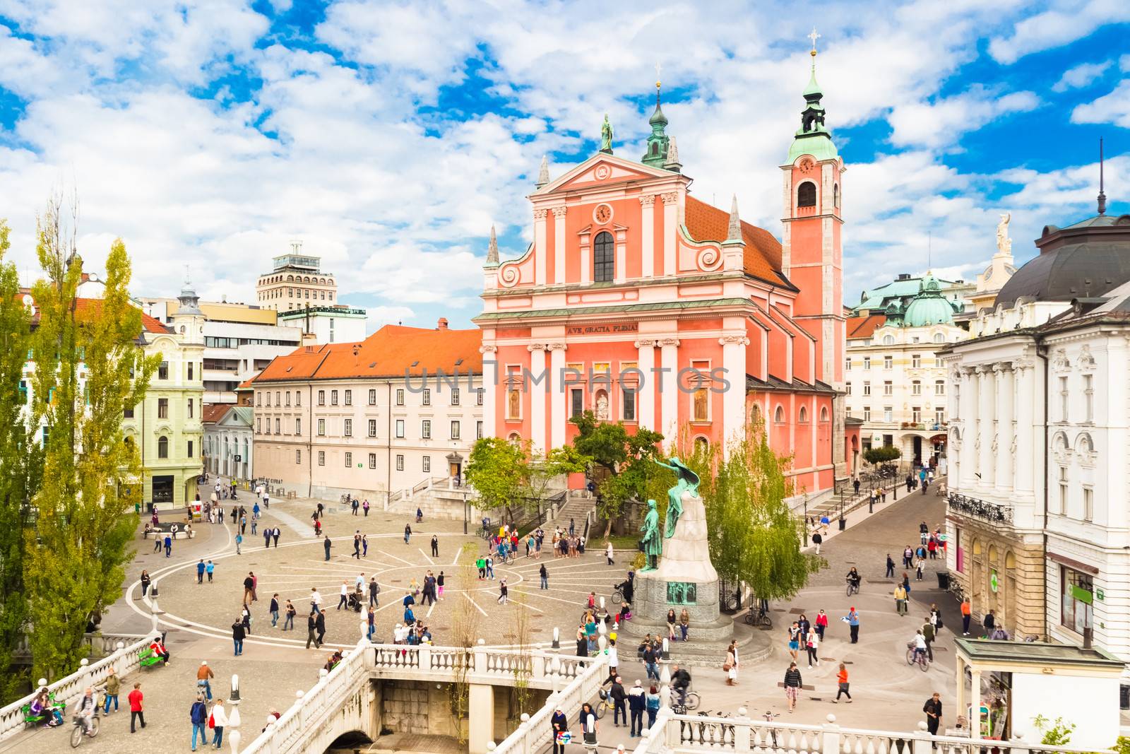 Romantic Ljubljana's city center:  river Ljubljanica, Triple Bridge (Tromostovje), Preseren square and Franciscan Church of the Annunciation; Ljubljana, Slovenia, Europe.