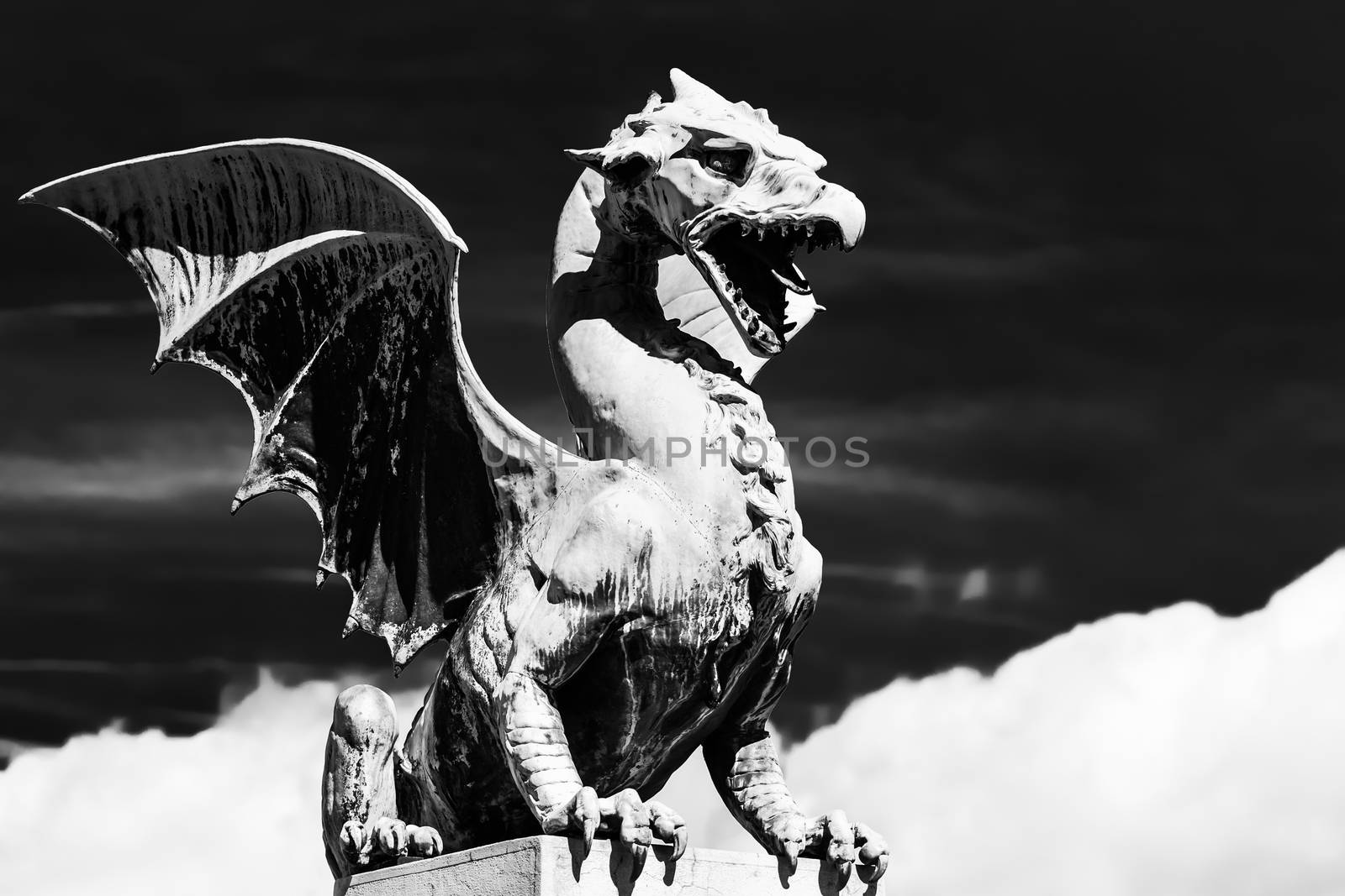 Famous Dragon bridge (Zmajski most), symbol of Ljubljana, capital of Slovenia, Europe. Black and white.