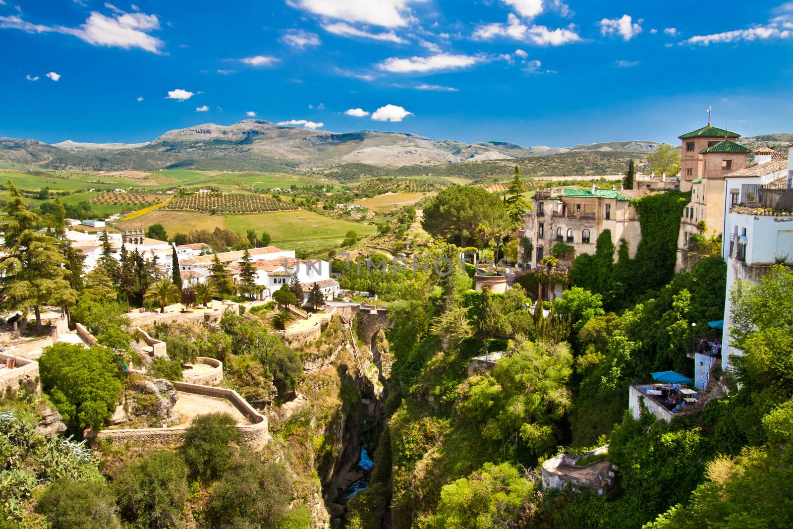 Panoramic view from a new bridge in Ronda, one of the famous white villages in Andalusia, Spain