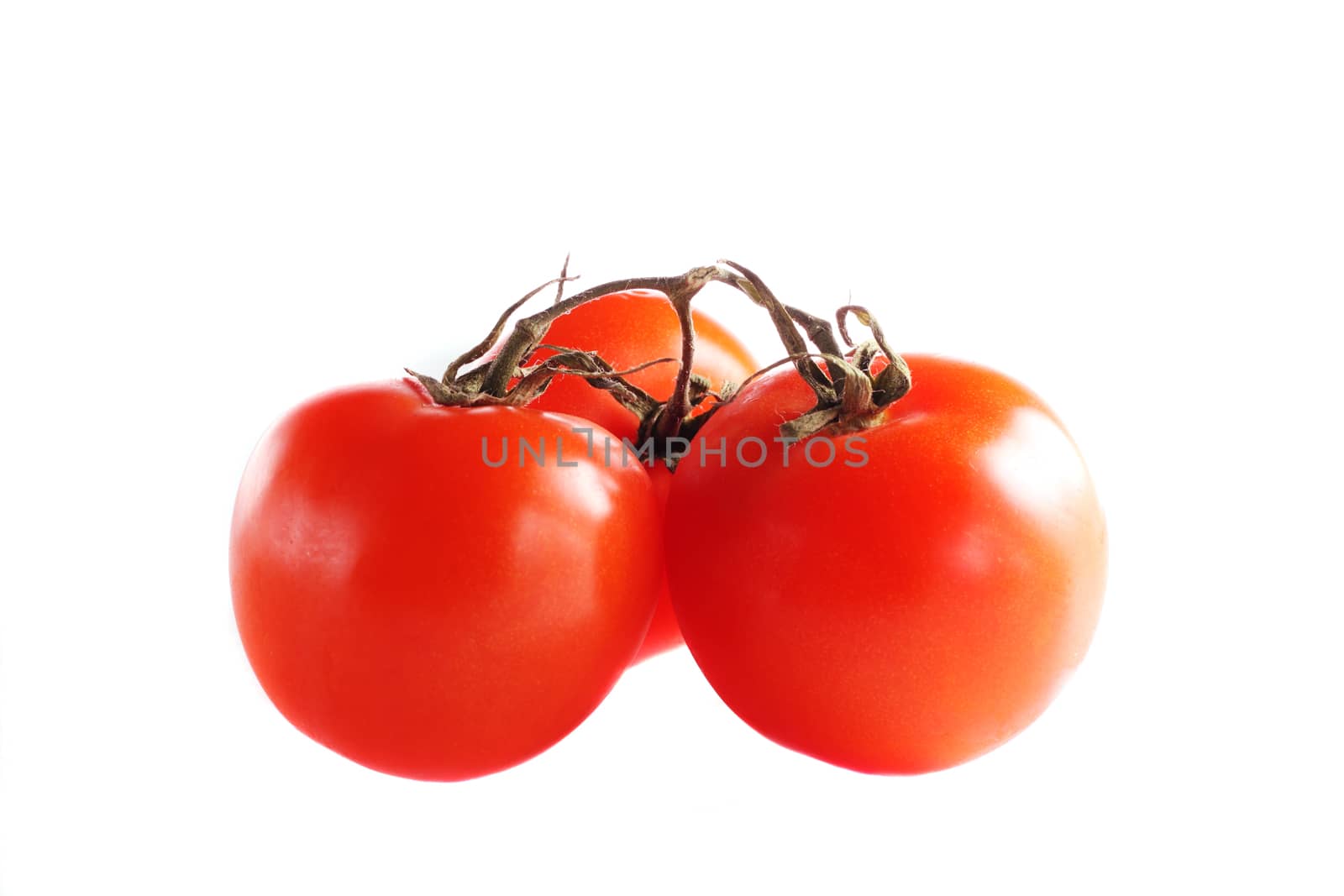 Some ripe tomatos isolated on the white background