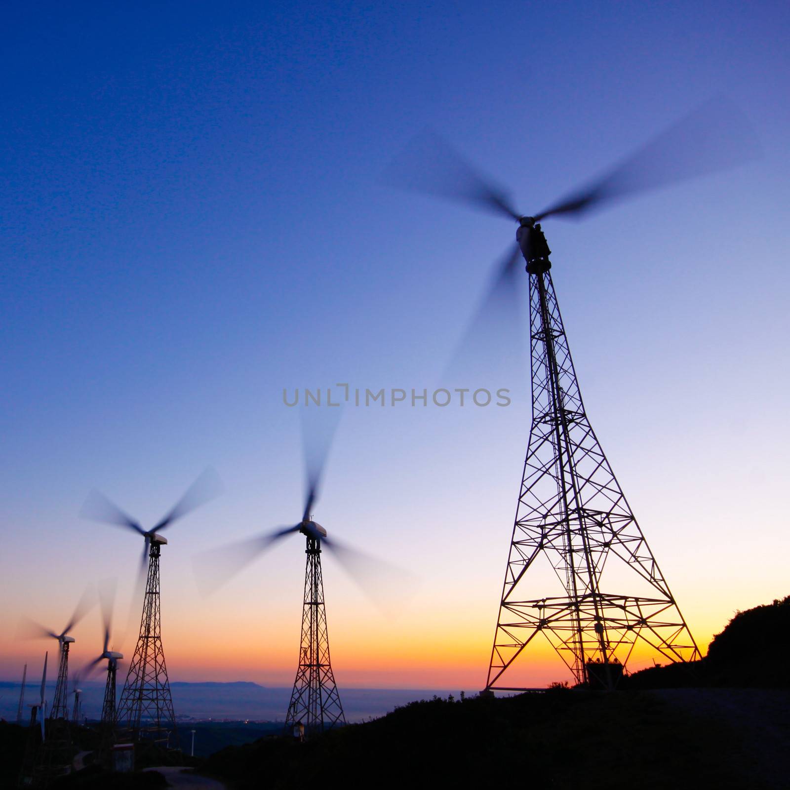 Wind farm in sunset by kasto