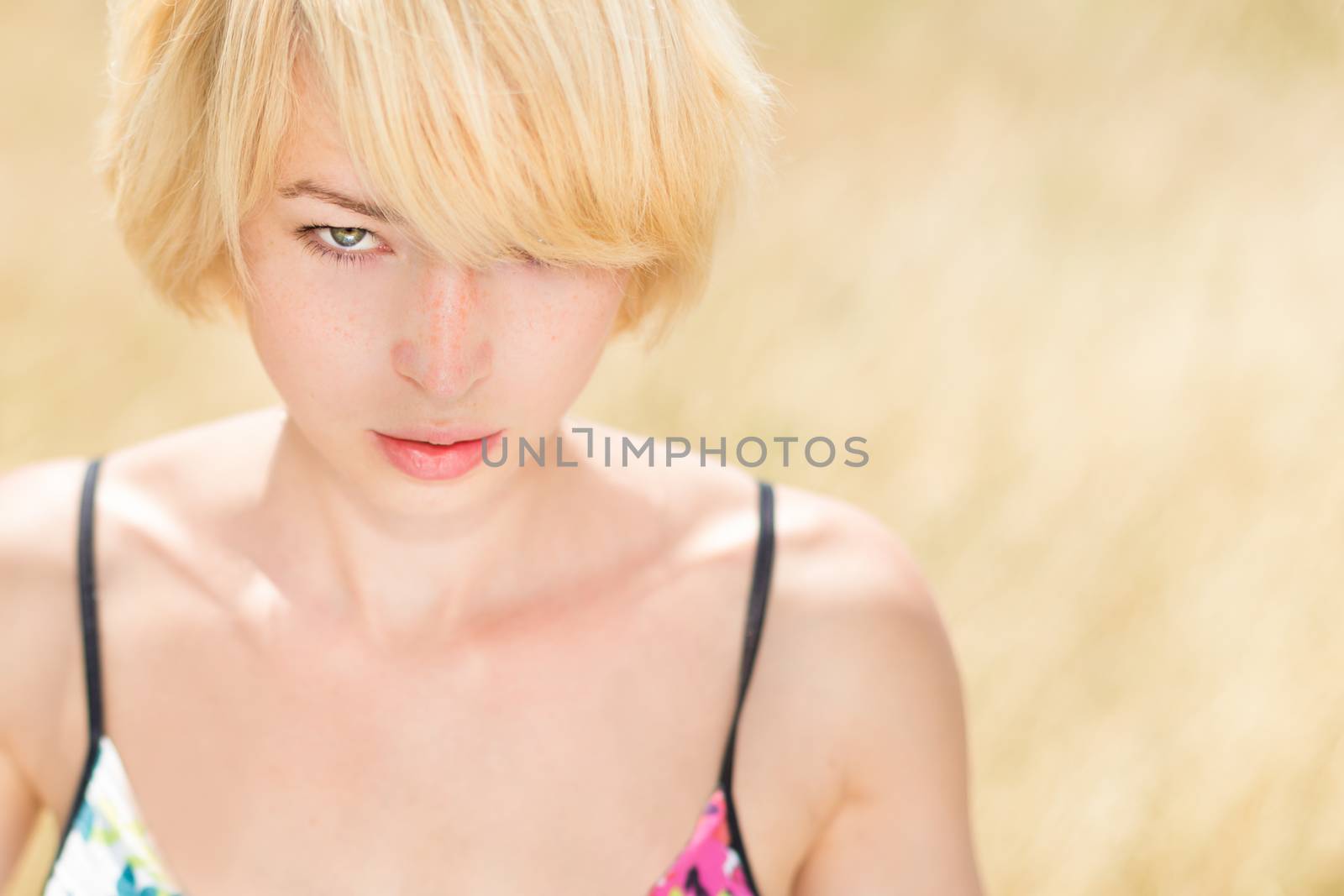 A portrait of beautiful young Caucasian woman outdoor. by kasto