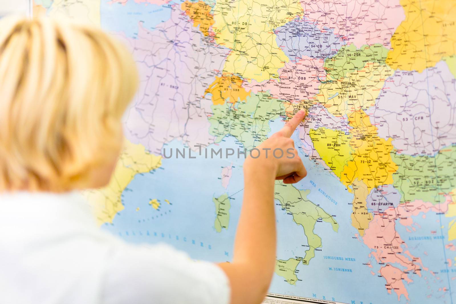 Lady pointing Slovenia on the map of Europe. by kasto