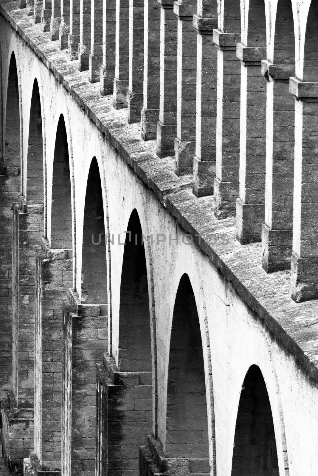 Architectural detail from the Saint Clement Aqueduct, Montpelier, France, shot in black and white.