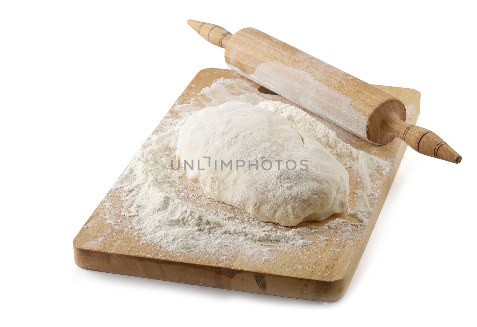 Piece of pastry on the wooden board with rolling-pin