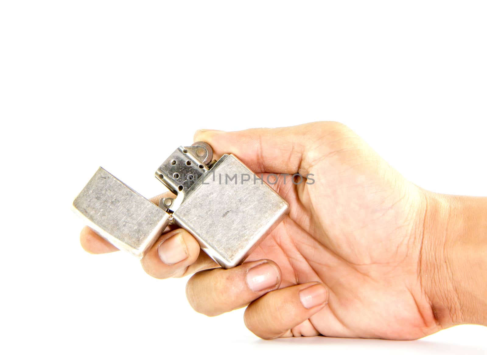 classic silver gasoline lighter in man hand  by bunwit