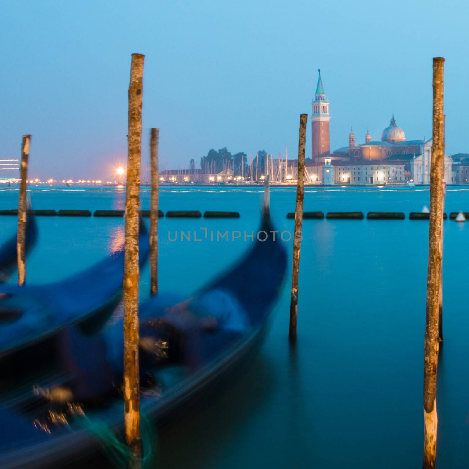 Venice in the evening light with gondolas on Grand Canal against San Giorgio Maggiore church. Italy, Europe. World heritage site.